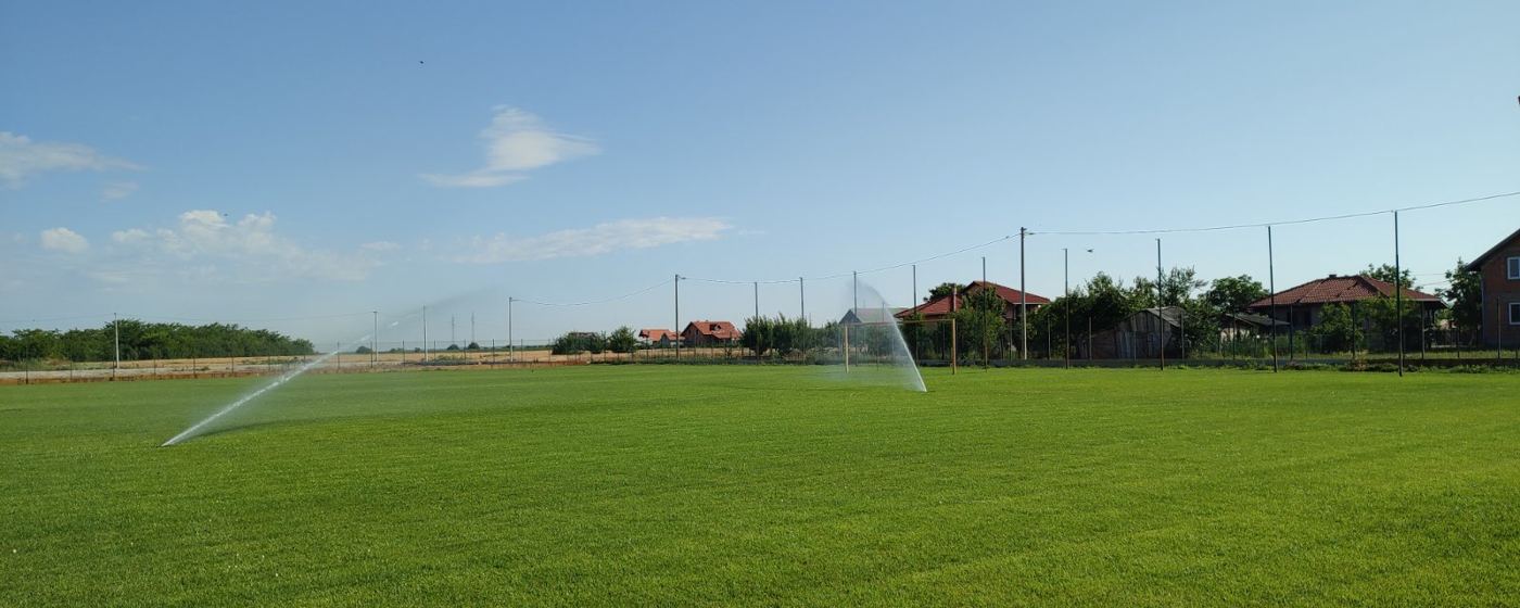 The pitch with sprinklers running, June 2022